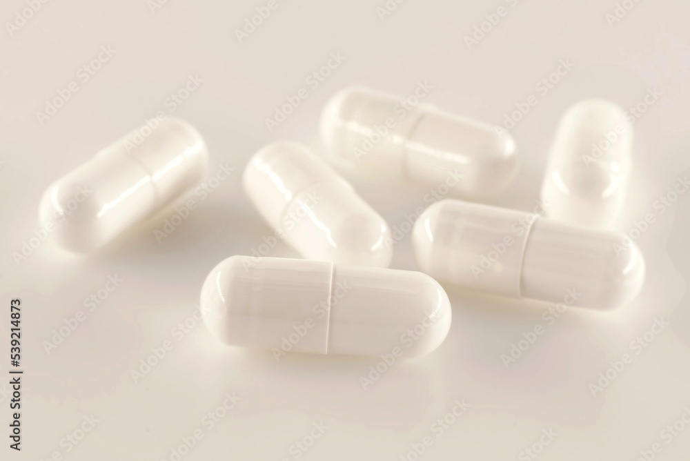 Medical capsules, pills on a white background close-up. Medical drug. Health. Treatment Medical capsules, pills on a white background close-up. Medical drug. Health. Treatment