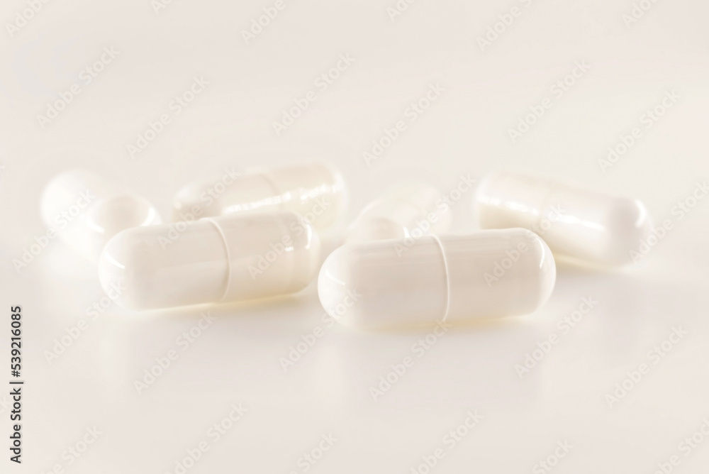 Medical capsules, pills on a white background close-up. Medical drug. Health. Treatment Medical capsules, pills on a white background close-up. Medical drug. Health. Treatment