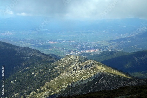 Cercedilla y la cresta conocida como Cuerda de las Cabrillas en Madrid, España. Visión desde el sendero que conduce a la cima de La Bola del Mundo en primavera. photo
