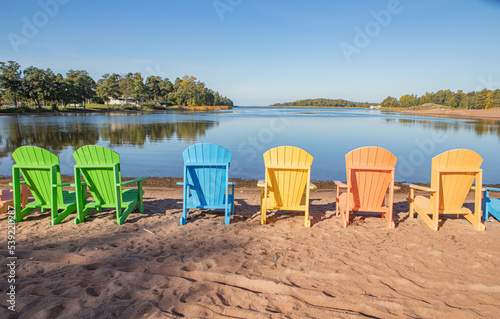 Colourful deck chairs on autumn beach