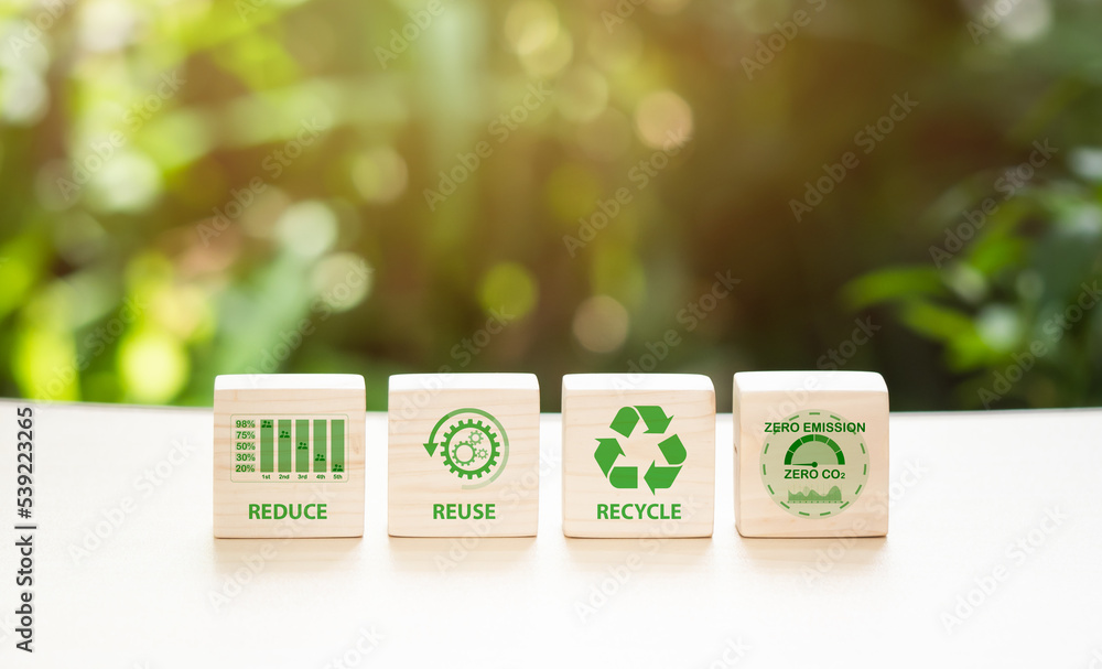 Concept of carbon footprint and reduced carbon emission. Carbon footprint symbols on a wooden cube with an eco-friendly emblem. Concept of environmental and climatic change. LCA.