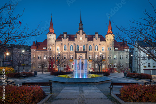 Walbrzych, Poland. View of Plac Magistracki square at dusk with illuminated building of Town Hall