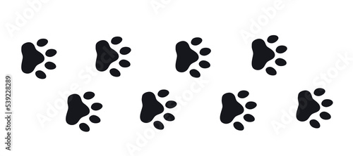 Silhouette of cat paws. Paw prints. The dog and cat puppy icon. Traces of a pet. The puppy's paws are highlighted on a white background.