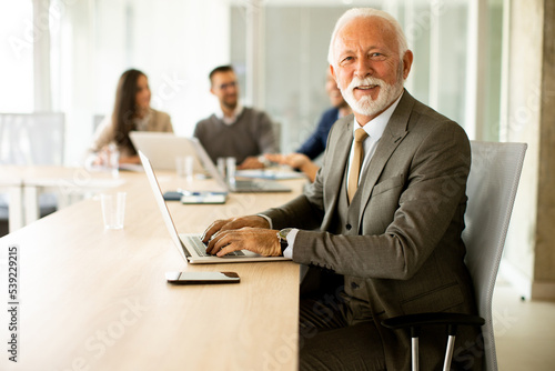 Senior business man working...
