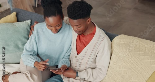 Phone, social media and communication with a black couple on a sofa to relax in their home together from above. Love, mobile and internet with a man and woman browsing the internet in the living room photo