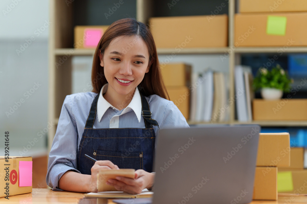 Asian small business owner working at home office. Business retail market and online sell marketing delivery, SME e-commerce concept Asian small business owner working at home office. Business retail market and online sell marketing delivery, SME e-commerce concept