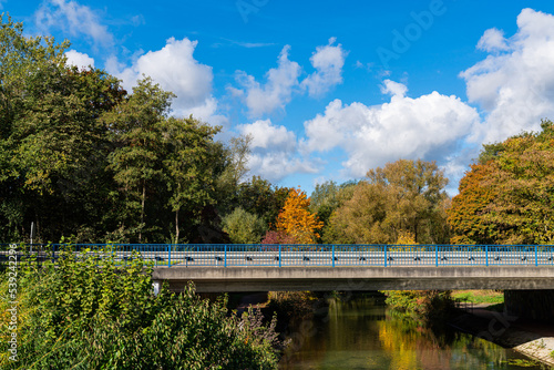 Wallpaper Mural Autumn landscape with a concrete bridge over a river and a blue sky with white clouds. Torontodigital.ca