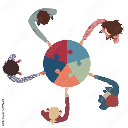 Group of business men and women top view holding and joining jigsaw puzzle pieces. Colleagues of diverse ethnic groups and cultures. collaborate - cooperate. Teamwork. Problem solving