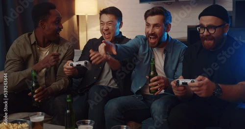 Men friends having fun playing video games and competing