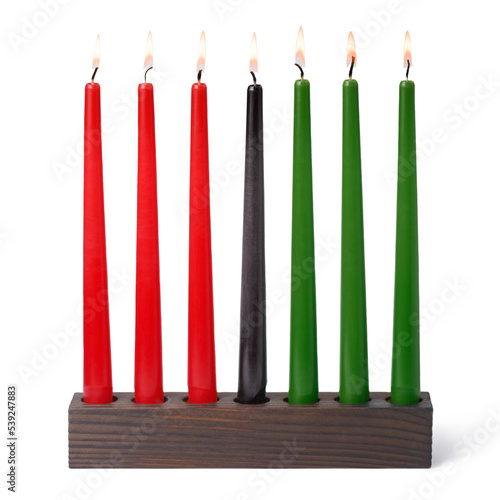 Kwanzaa festival concept with seven candles red, black and green in candlestick is isolated on white background