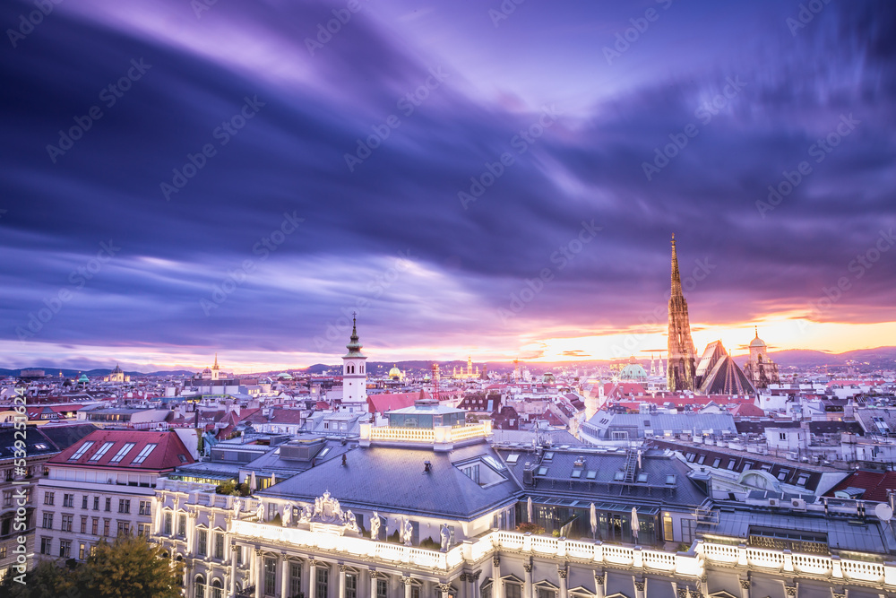 St. Stephen's Cathedral and Vienna old town cityscape at dramatic sky, Austria