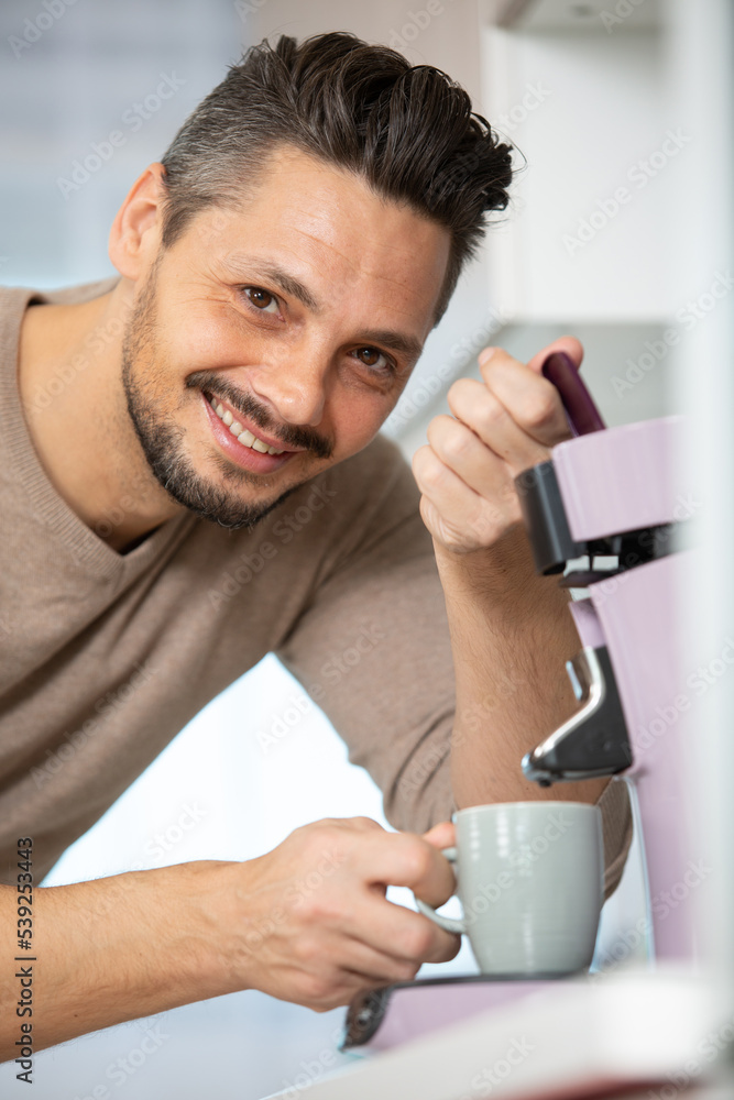 a man prepares espresso for a coffee maker a man prepares espresso for a coffee maker