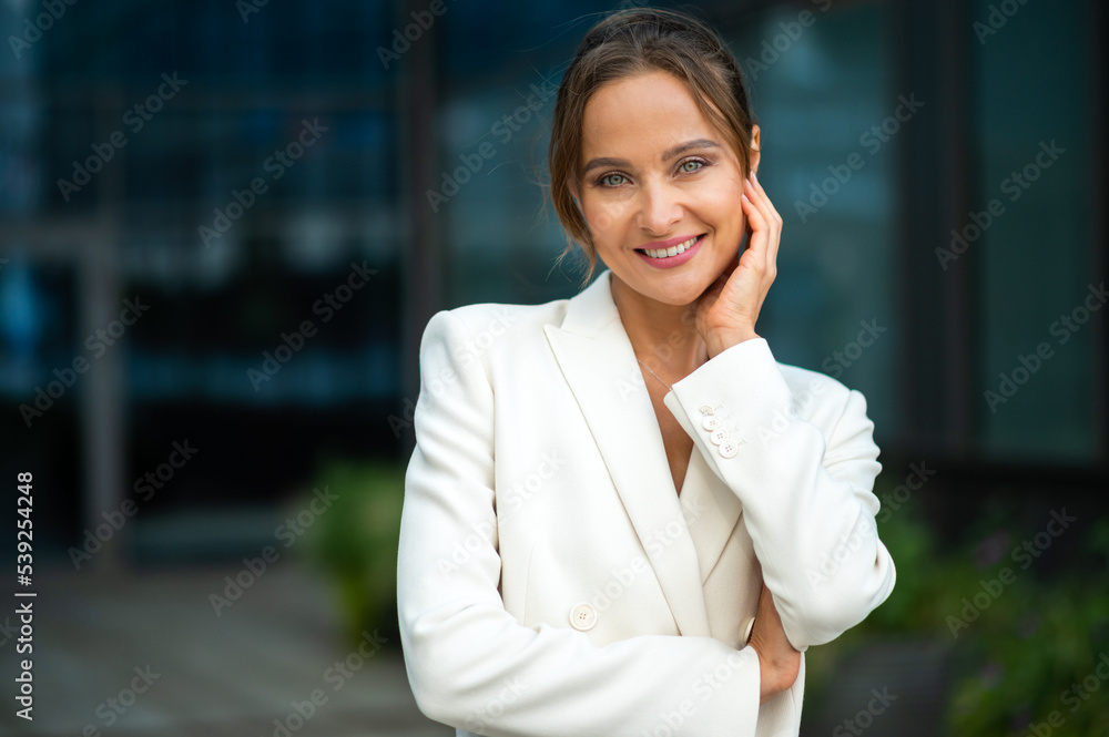 Confident young female manager outdoor in a modern urban setting Confident young female manager outdoor in a modern urban setting