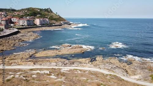 PAN SHOT - Cuncheira Beach and the Cies Islands viewed from the Monterreal Fortress on the Monte Boi peninsula in the Galician village of Baiona, Galicia, Spain. photo