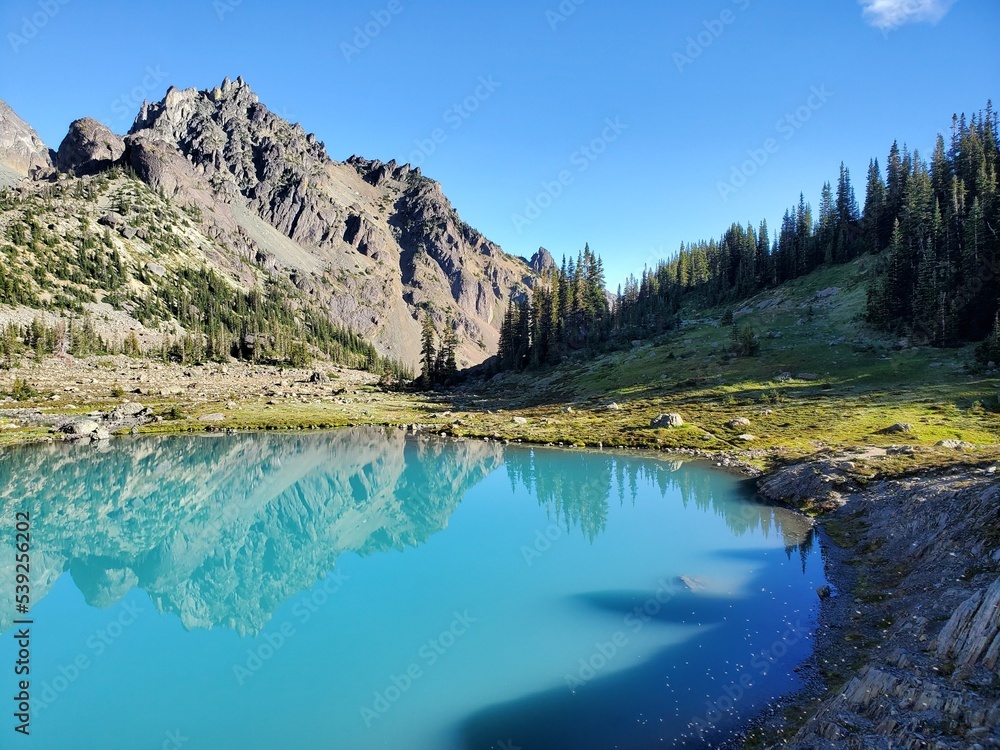 Mountains reflected in lake.