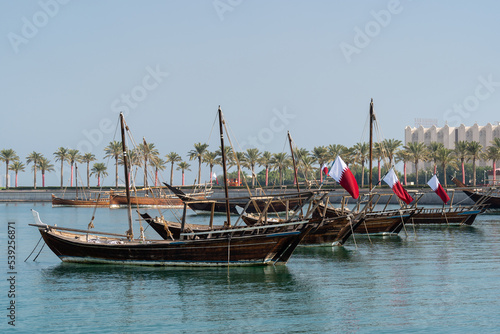 Traditional arabian dhows with Qatar flags in Doha   Qatar.