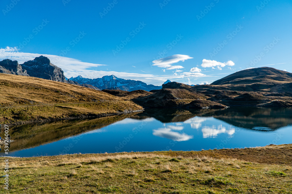 peaceful afternoon on a sunny autum day at the alpine lake Tannensee in Melchsee-Frutt, Swiss alps