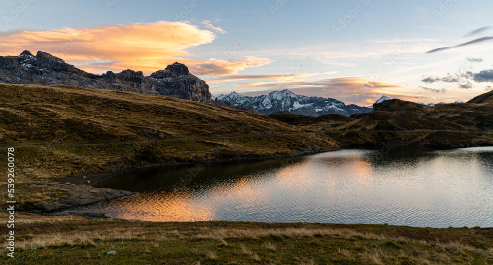 beautiful sunset at Tannensee lake in Melchsee-Frutt in the Swiss alps on a nice autumn day