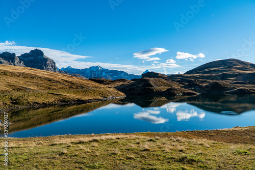 peaceful afternoon on a sunny autum day at the alpine lake Tannensee in Melchsee-Frutt  Swiss alps