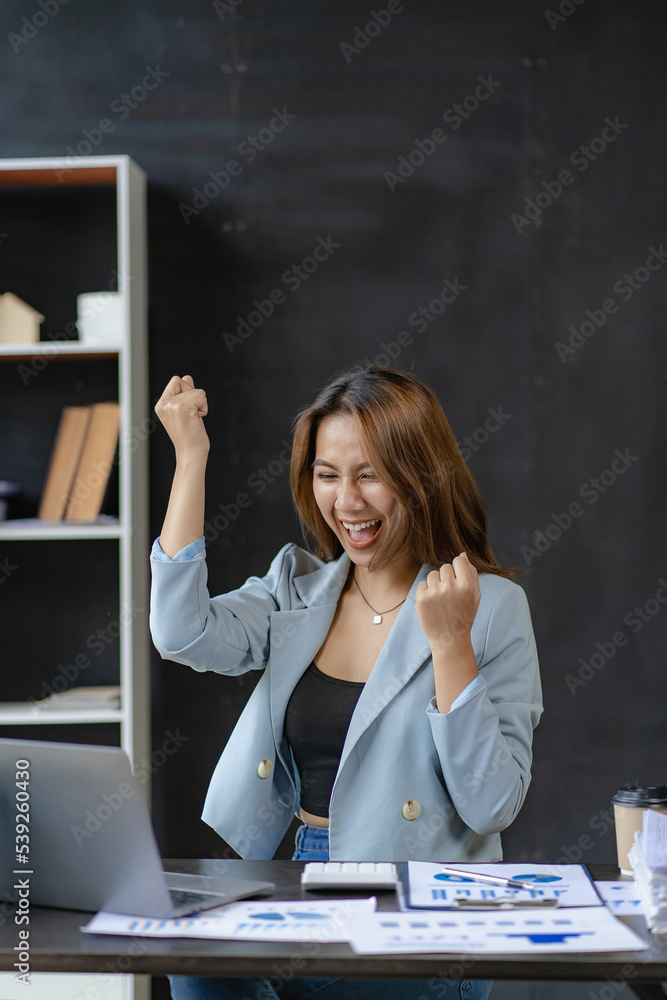 business woman working in office with laptop and working finance graph document Review and calculate financial costs annual balance sheet financial balance sheet business woman working in office with laptop and working finance graph document Review and calculate financial costs annual balance sheet financial balance sheet