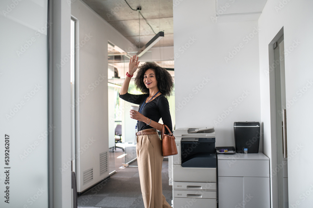 Confident curly-haired business woman in the office Confident curly-haired business woman in the office