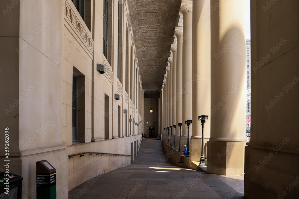 Fototapeta premium Old restored building - massive columns and a long corridor. Ancient architecture. 
