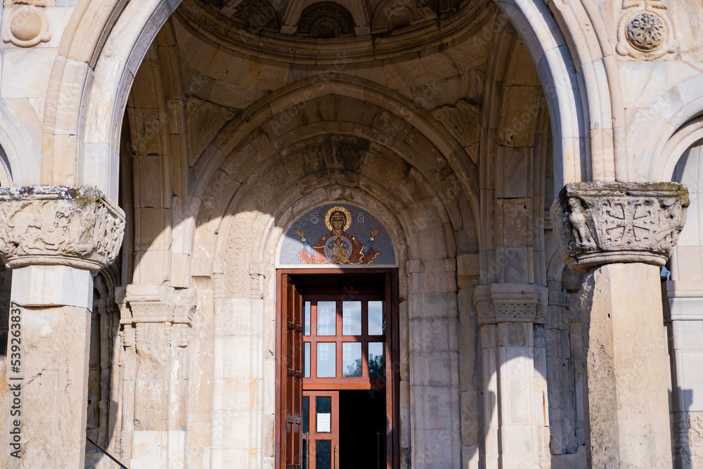 Entrance gate of Bagrati Cathedral in Kutaisi, Dormition, an 11th century cathedral in Georgia's Imereti region, old building concept idea photo.