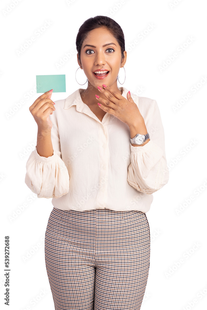 Cheerful Indian young business woman showing business card on white. Cheerful Indian young business woman showing business card on white.