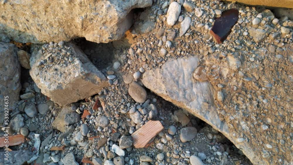 Rubble on the demolition site of a reinforced concrete building. Pile ...