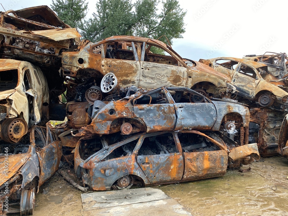 Fototapeta premium A bunch of burned and shelled cars in Hostomel in the Kyiv region