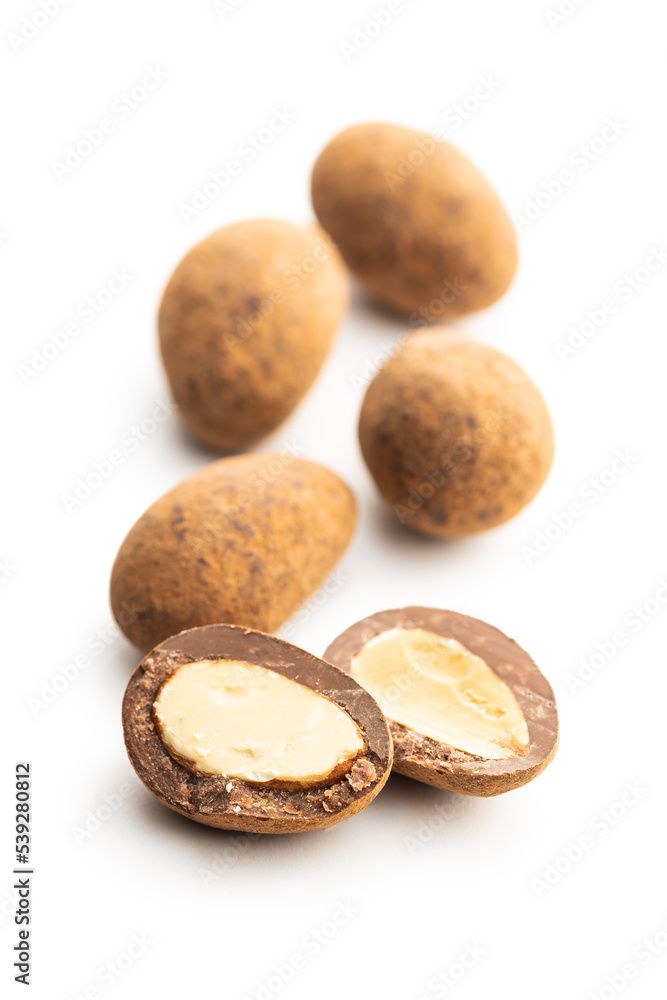 Almonds in chocolate coated in cocoa powder isolated on white background. Almonds in chocolate coated in cocoa powder isolated on white background.