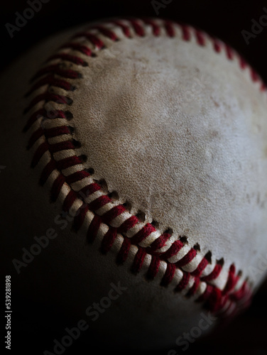 Canvas Print Baseball photographed in natural light with a dark background