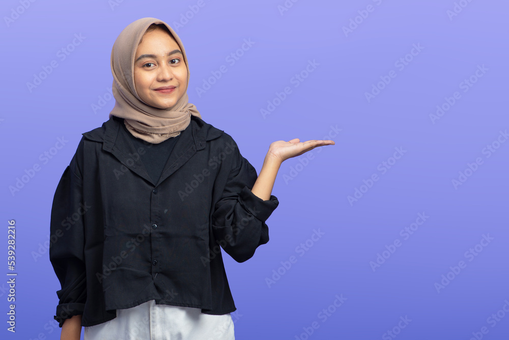 Asian Muslim Woman Pointing at Copy Space, Isolated Asian Muslim Woman Pointing at Copy Space, Isolated
