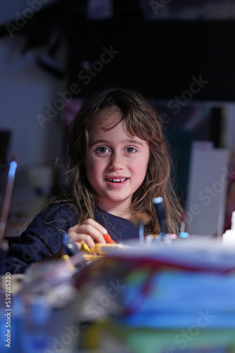 Young girl 6-7 years old drawing