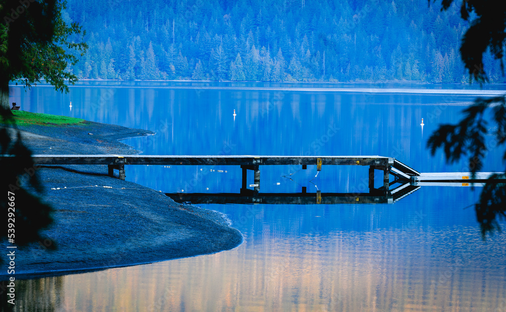 Quiet dock on lake early morning
