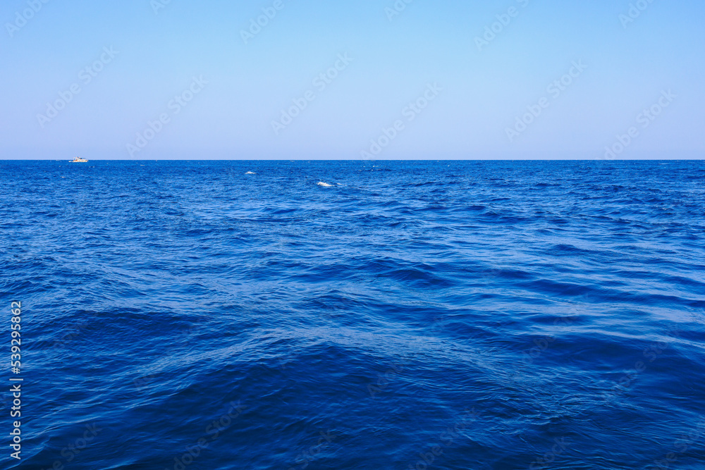 Fototapeta premium View of the open sea from the yacht. Background with selective focus