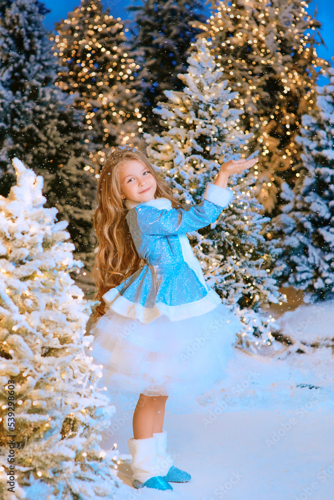 cute Caucasian blonde girl walking winter christmas forest with lights. New year, fairy tale concept cute Caucasian blonde girl walking winter christmas forest with lights. New year, fairy tale concept
