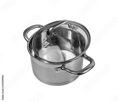 New cooking pot isolated. Metal saucepan with glass lid, soup kitchenware, shiny stainless cooking pot on white background, clipping path