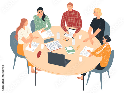 Group of students at the table studying, learning together