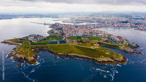 Aerial view of coast with lighthouse and center of A Coruna city, Spain