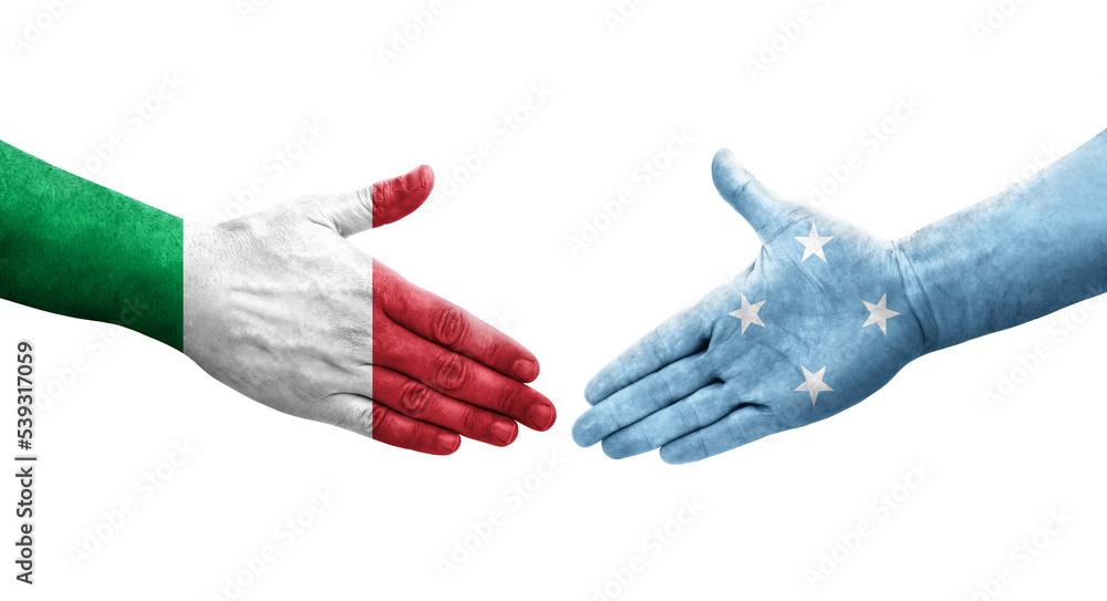 Handshake between Italy and Micronesia flags painted on hands, isolated transparent image. Handshake between Italy and Micronesia flags painted on hands, isolated transparent image.