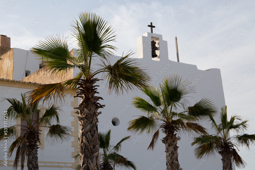 White church bell tower in a Mediterranean area