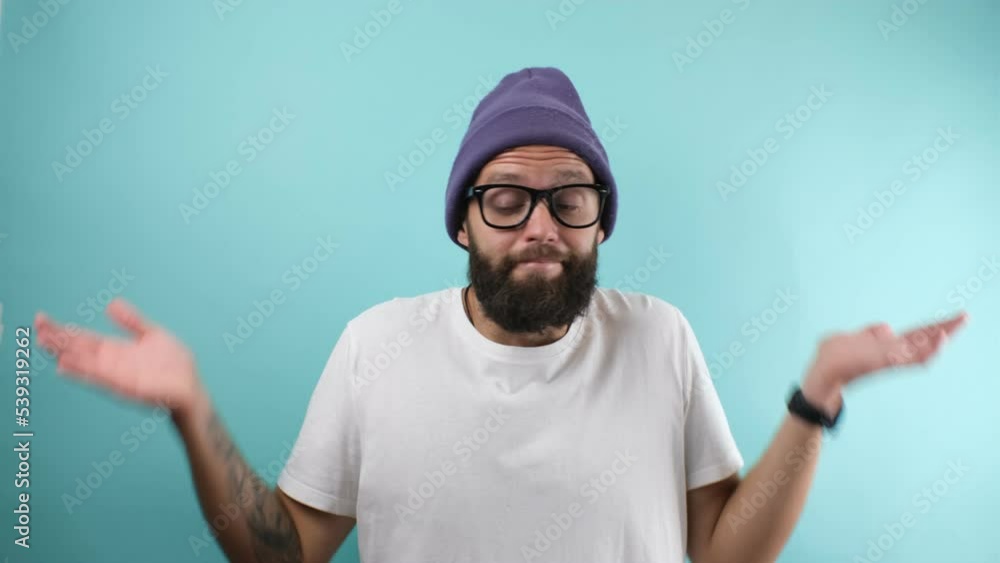 Crazy hipster guy emotions. I dont know why. The guy shrugs and is clearly unsure. Crazy hipster guy emotions. I dont know why. The guy shrugs and is clearly unsure.