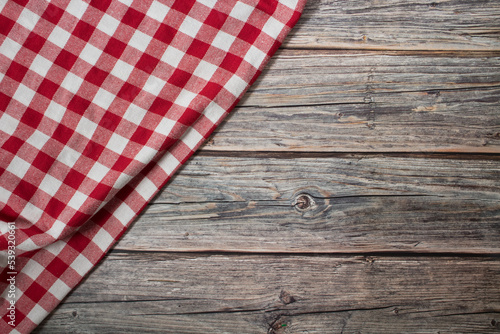 Checkered tablecloth on old wooden table