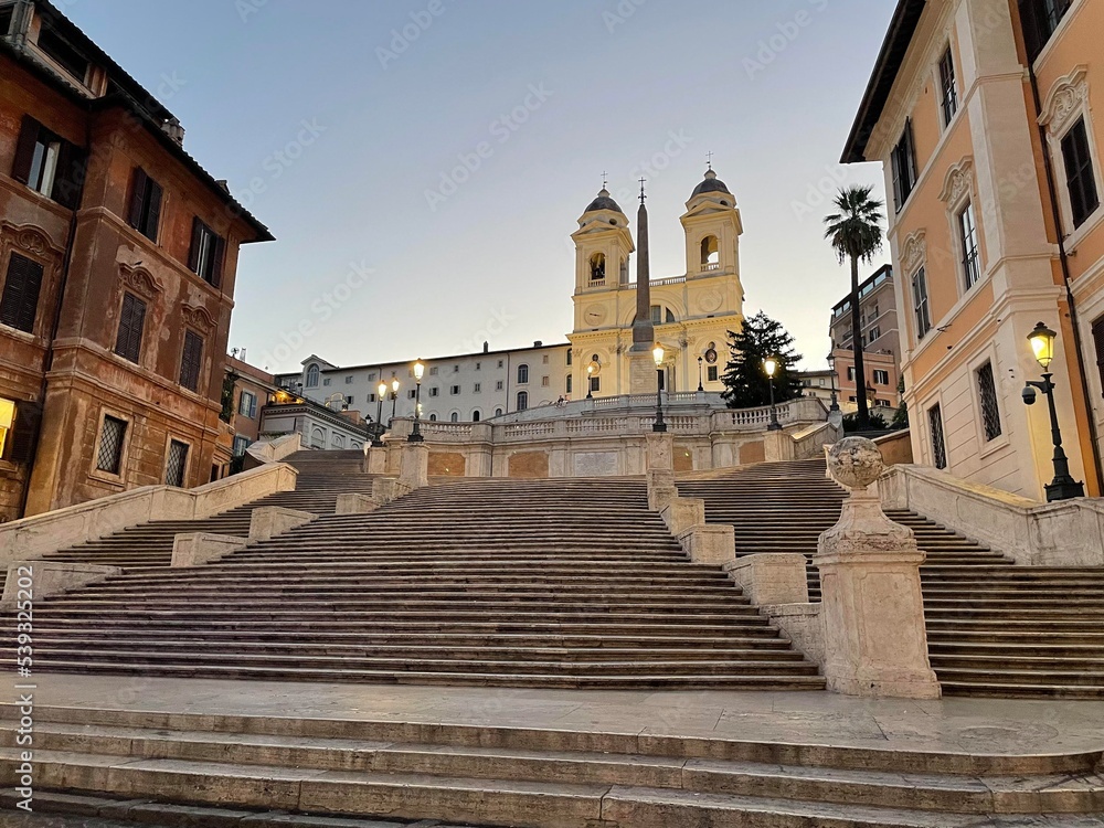 Early clear summer morning Spanish Steps Rome Italy no people lamps glowing 2022