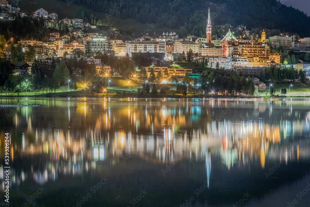 St Moritz cityscape and lake reflection at night, Engadine, Swiss alps St Moritz cityscape and lake reflection at night, Engadine, Swiss alps