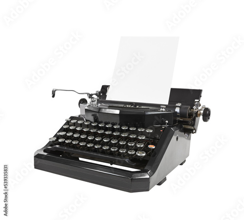 Old typewriter with blank paper isolated. photo
