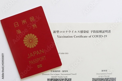 Japanese passport and Proof of COVID-19 Vaccination issued in Japan. Tokyo, Japan. October 19, 2022.