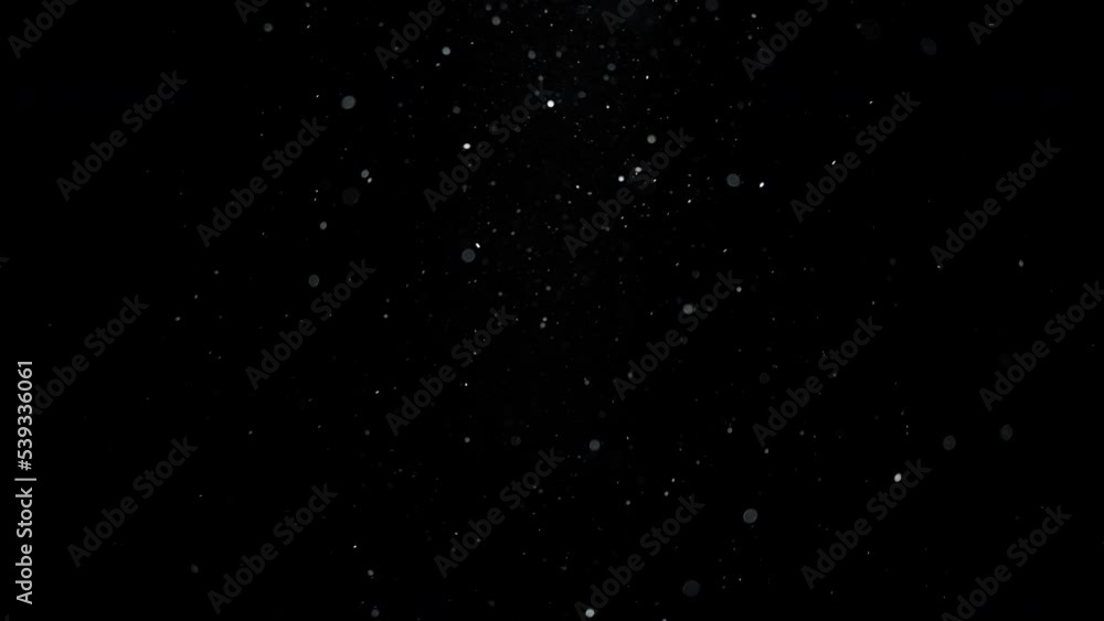 Background of white dust particles flowing in the air. Slow motion. Background of white dust particles flowing in the air. Slow motion.