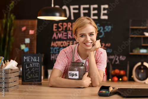 Young female barista with t...
